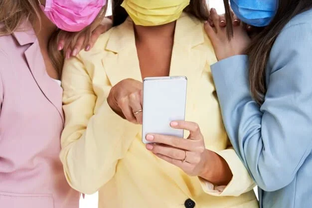 A close-up of a smartphone screen displaying a trending social media campaign hashtag with diverse hands in the background, symbolizing collective participation and a unified message.