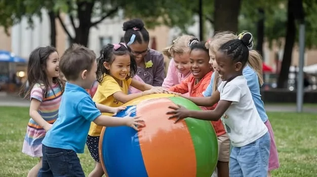 A group of diverse kindergarten children happily playing together on a colorful playground, demonstrating cooperation and social interaction.