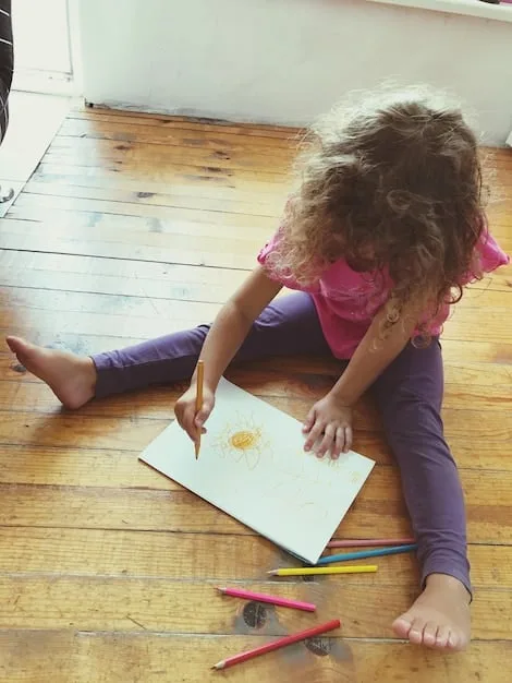 A child drawing their feelings with colorful crayons on a large piece of paper, while an adult sits beside them attentively, illustrating creative expression and supportive interaction.