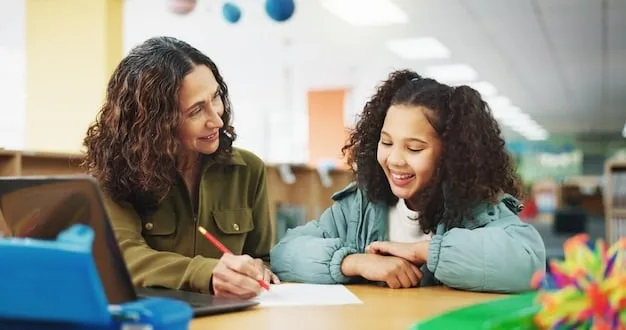 A teacher smiling and interacting individually with a student at a desk, while other students in the background are engaged in different self-directed learning activities, showcasing a personalized classroom environment.