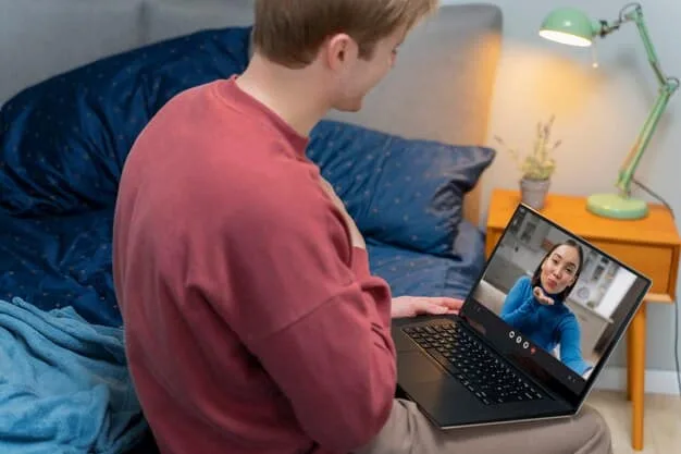 A young adult Gen Z male engaging in a virtual therapy session on a laptop, with a calm and focused expression, highlighting the accessibility and personal nature of online mental health support.