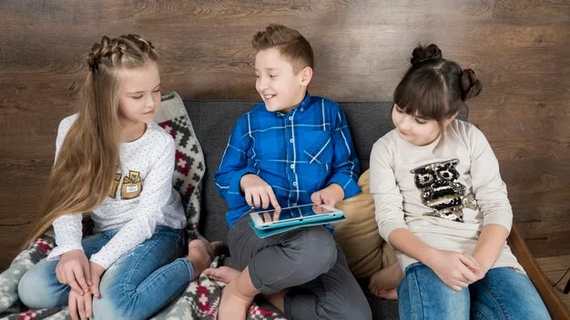 A group of Gen Z children in an ECE setting playing with interactive educational tablets, demonstrating the integration of technology in their learning.