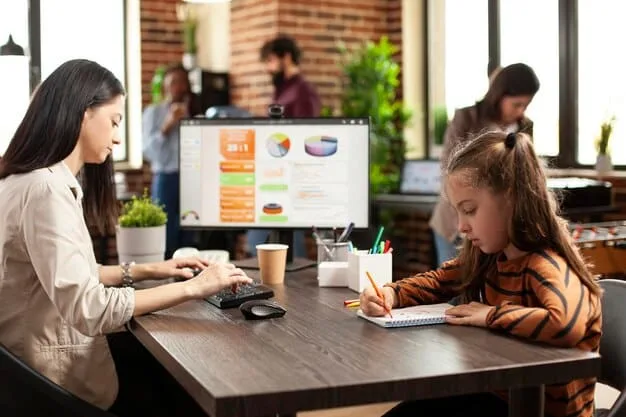 A teacher and a student looking at a data dashboard on a large screen, showing positive behavior trends and individual progress metrics, representing data-driven classroom management.