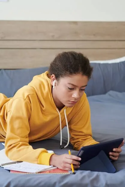 A Gen Z student quickly scrolling through educational content on a tablet or smartphone, featuring short video clips, infographics, and interactive quizzes. The background shows a digital learning interface.