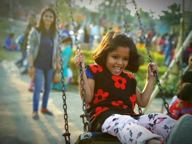 A diverse group of children with varying abilities playing together in an inclusive playground, symbolizing community and acceptance.
