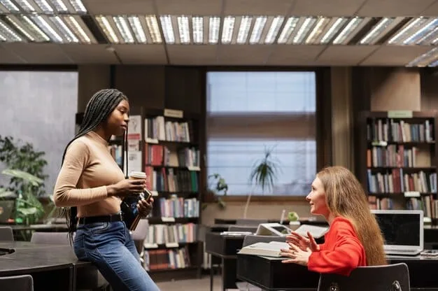 An educator engaging with a student one-on-one, both looking at a tablet displaying interactive learning content, in a modern, brightly lit classroom setting.
