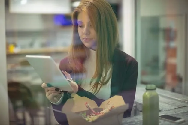 A Gen Z student proudly showing a teacher their completed digital project on a tablet, with a classroom blurred in the background.