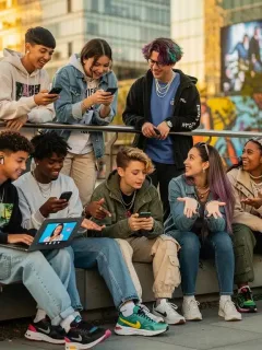 Gen Z teens interacting digitally and in person, reflecting complex social dynamics.
