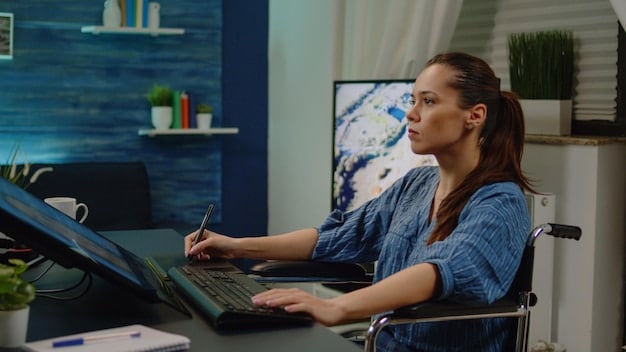 An employee with a visual impairment using screen reader software on a computer at their workstation. The image illustrates a practical example of a reasonable accommodation in the workplace.
