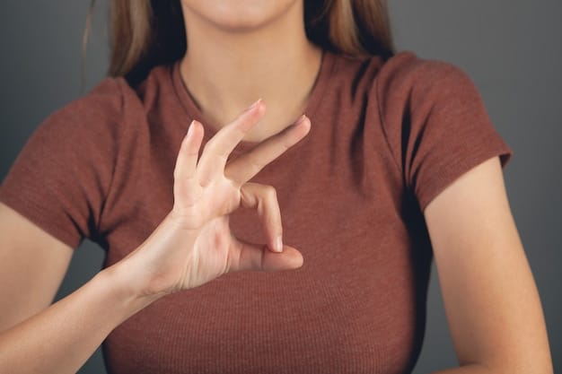 A close-up shot of a person using sign language. Their hands are expressing a message of inclusivity and understanding. The background is blurred, focusing on the clarity and importance of non-verbal communication in promoting inclusivity.