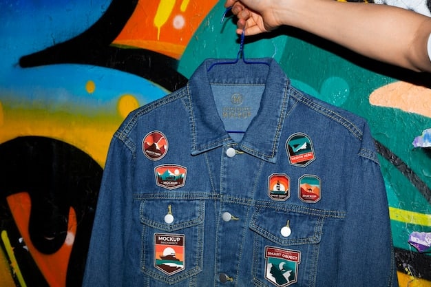 A person decorating a denim jacket with various patches and pins, showcasing the personalized and DIY aspect of streetwear. The background is a cluttered but inspiring workspace with various crafting supplies.