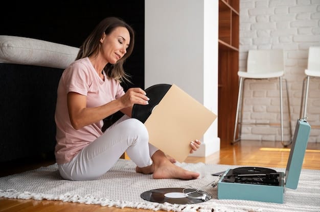 A young woman sitting on her bedroom floor, surrounded by vinyl records. She is holding a record sleeve and carefully examining the artwork. Her room is decorated with vintage posters and string lights, creating a cozy and personalized space. A turntable is set up on a nearby table, ready for use.
