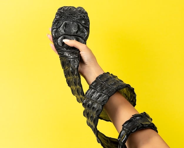Close-up of a cosplayer's hand holding a 3D-printed prop weapon with intricate details, showcasing the precision and craftsmanship achievable with 3D printing technology in cosplay. The background is blurred but indicates a busy convention floor.