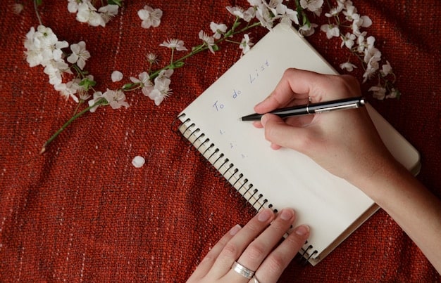 A close-up of a person journaling with a pen and a notebook. The page contains some handwritten notes and doodles. The background should be blurred, focusing on the person's hand and the notebook.