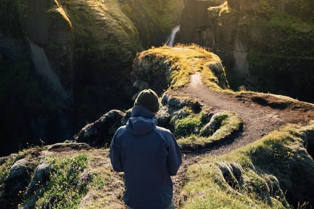 A person hiking alone in a mountain trail, surrounded by nature, looking determined and peaceful.