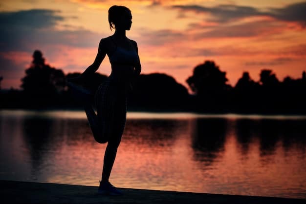 A person practicing yoga at sunset, symbolizing the importance of physical self-care and relaxation.