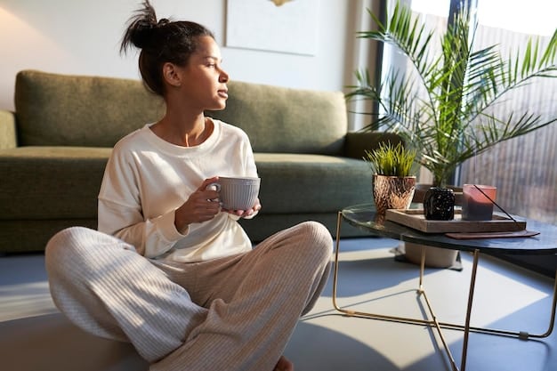A person sitting comfortably on a couch, using a guided meditation app on their smartphone. Soft lighting fills the room, and a cup of tea sits on the coffee table nearby.