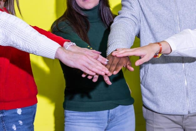 A close-up of diverse Gen Z hands interlocking, symbolizing unity and collective power, with a blurred protest background.