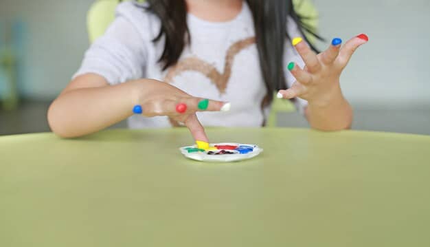 A child engaged in a therapy session, perhaps with a speech therapist using colorful cards or a physical therapist guiding motor movements, demonstrating active, engaging early intervention in a child-friendly setting.
