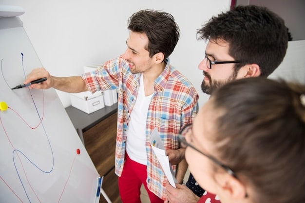 A close-up of a student writing on a whiteboard while two other students look on, illustrating an active brainstorming session during collaborative learning.