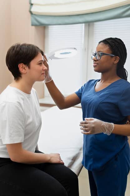 A doctor reassuring a patient with gentle eye contact, symbolizing trust and compassionate care in a clinic setting.