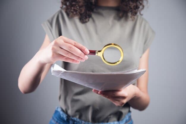 A hand holding a magnifying glass over a document with diversity metrics, symbolizing the importance of data analysis and transparency in addressing systemic issues.