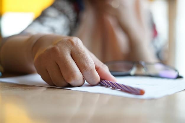 A close-up of a student's trembling hand holding a pencil over an exam paper, conveying intense pressure and fear of making mistakes during a test.