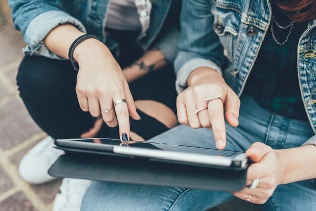 A close-up shot of a Gen Z student's hands on a tablet, actively tapping and swiping through an educational app with game-like elements. The screen displays colorful graphics, progress bars, and positive reinforcement messages.