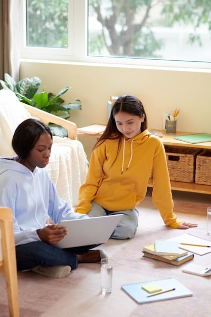 A school counselor gently speaking with a Gen Z student in a brightly lit, comforting counseling room, with resources like brochures on a table, signifying mental health support.