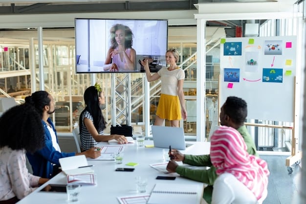 A group of Gen Z professionals in a modern office space, collaborating on a digital project displayed on a large screen, demonstrating effective teamwork and professional interaction.