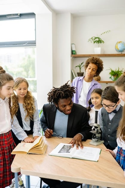 A diverse group of students and teachers engaged in a classroom discussion, focusing on different perspectives during an anti-bias training session. They are seated around a table, animatedly exchanging ideas with open body language.